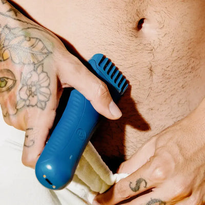 Man using the Meridian trimmer to trim pubic hair